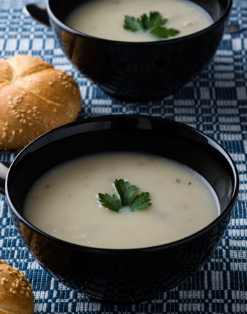 fresh healthy champignon soup in black bowlの写真素材