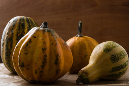variety of decorative pumpkins on wooden table