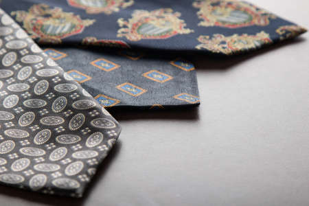 three elegant colorful male ties on tableの写真素材