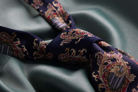 elegant colot fashion tie on green silkの写真素材