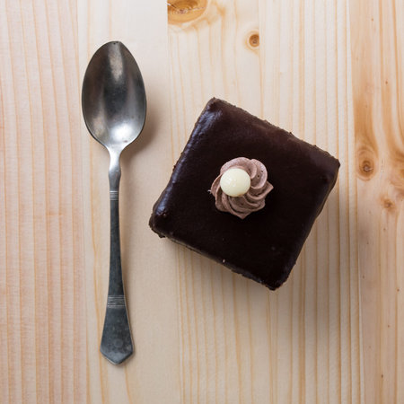 delicious brown chocolate cake on wooden table