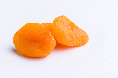sweet dried orange peach on white table