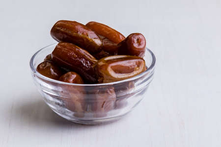 sweet dried dates fruit on white tableの写真素材