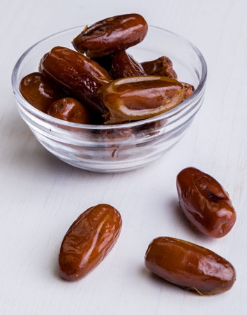 sweet dried dates fruit on white tableの写真素材