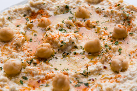 creamy delicious fresh home made hummus closeupの写真素材