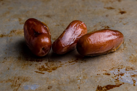 sweet dried dates fruit on steel plate