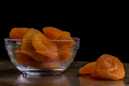 sweet dried orange peach on steel plateの写真素材