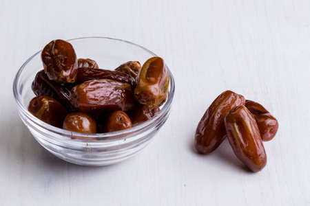 sweet dried dates fruit on white tableの写真素材