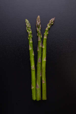green healthy organic asparagus on black tableの写真素材