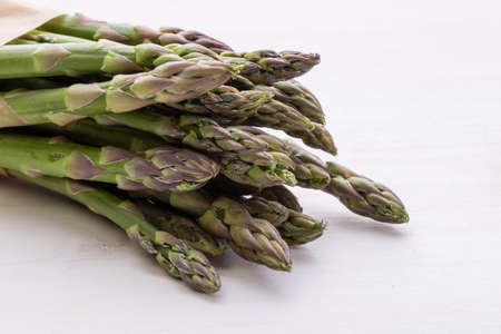natural organic healthy green asparagus on white tableの写真素材