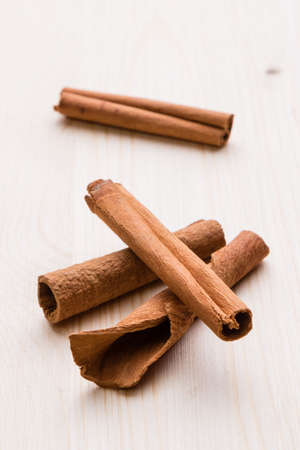 brown healthy cinnamon sticks spice on wooden table