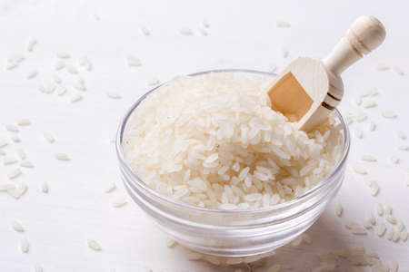 white rice in a glass jar on tableの写真素材
