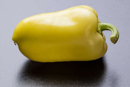 fresh ripe raw paprika on black tableの写真素材