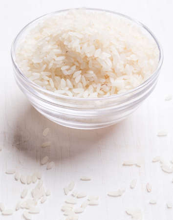 white rice in a glass jar on tableの写真素材