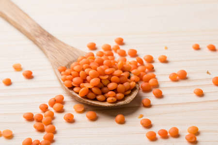 natural organic dry red lentils with spoon