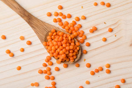 natural organic dry red lentils with spoon