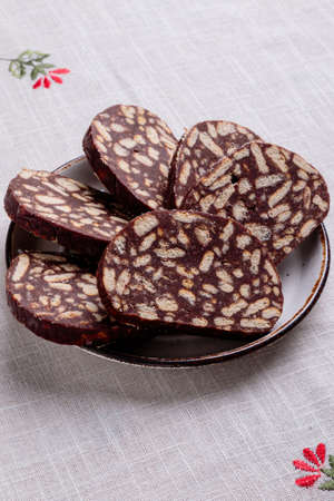 delicious dessert tasty chocolate biscuit salami on plateの写真素材