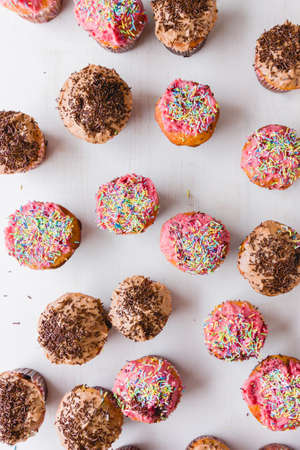 abundance of homemade cupcakes on table, shot from aboveの写真素材