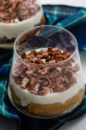 traditional italian tiramisu dessert in glass with chocolateの写真素材