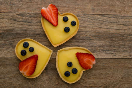 heart shape vanilla tart with strawberry and blueberryの写真素材