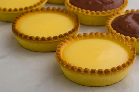 round sweet vanilla tart on white table