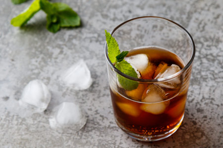 cold refreshing ice tea with ice cubes in glassの写真素材