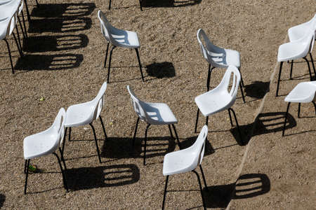 not arranged white empty plastic modern chairsの写真素材