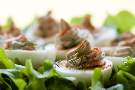 gourmet deviled eggs decorated with paprika and dill