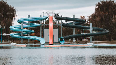abandoned water slide in aquapark, autumn shotの写真素材