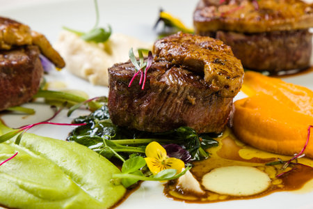 beef filets with foie gras and three types of mashed potatoesの写真素材