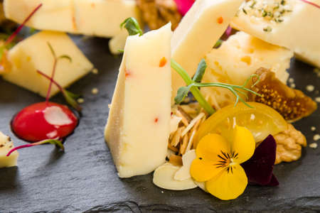 gourmet cheese platter with different types of cheeseの写真素材