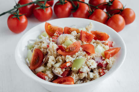 healthy vegetarian quinoa salad with pepper and tomatoesの写真素材