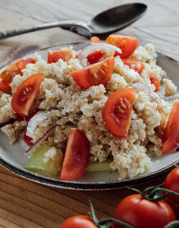 healthy vegetarian quinoa salad with pepper and tomatoesの写真素材