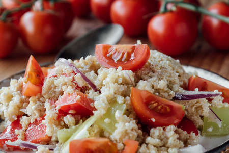 healthy vegetarian quinoa salad with pepper and tomatoesの写真素材
