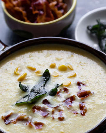 corn cream soup with bacon and sageの写真素材