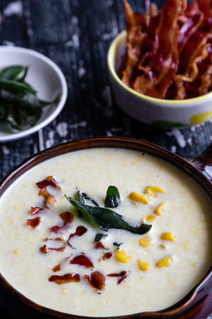 corn cream soup with bacon and sageの写真素材