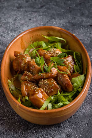 small tasty fresh chicken bites in a rustic bowlの写真素材