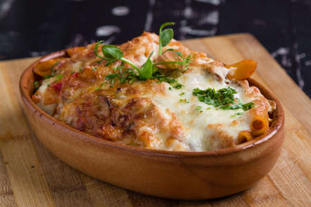 tasty delicious penne rigate pasta in rustic bowlの写真素材