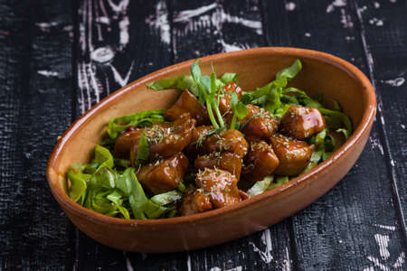small tasty fresh chicken bites in a rustic bowlの写真素材