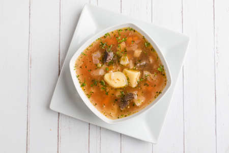 fresh tasty traditional stew soup in white bowlの写真素材