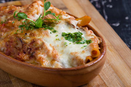 tasty delicious penne rigate pasta in rustic bowlの写真素材