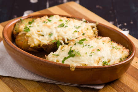 fresh healthy baked delicious baked potato on white plateの写真素材