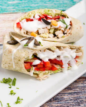 tasty wrap with chicken meat and greensの写真素材
