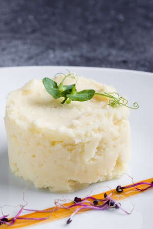fresh mashed potato portion on white plateの写真素材