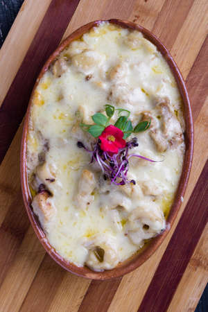 tasty delicious baked tortellini pasta in rustic bowlの写真素材