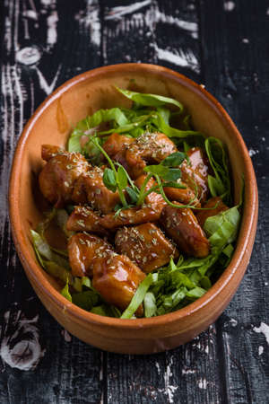 small tasty fresh chicken bites in a rustic bowlの写真素材