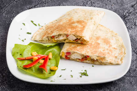 tasty fresh quesadilla with chicken meat and vegetablesの写真素材