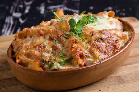 tasty delicious penne rigate pasta in rustic bowlの写真素材