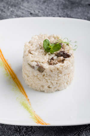 cooked tasty rice portion on white plateの写真素材