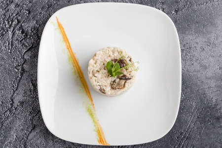 cooked tasty rice portion on white plateの写真素材